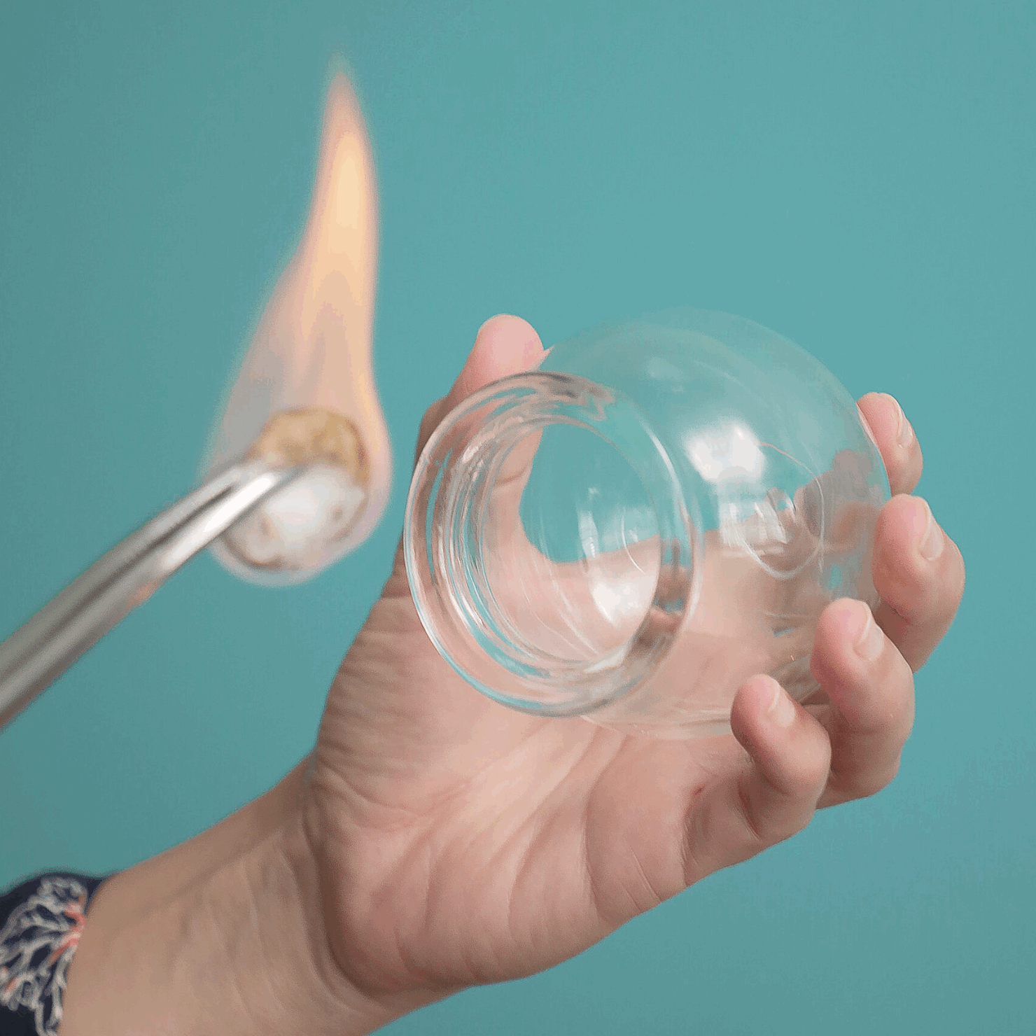 Photo of cotton ball on fire used in cupping therapy